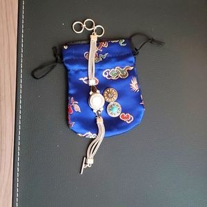 Sliver bracelet with 3 interchangeable center pieces.